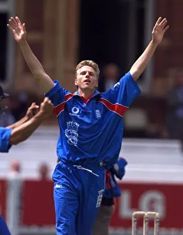 Alan Mullally celebrates taking his third wicket May 1999 for England in their
