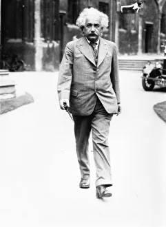 Inventor Prints: Albert Einstein Professor walking in the College Quadrangle. 1933