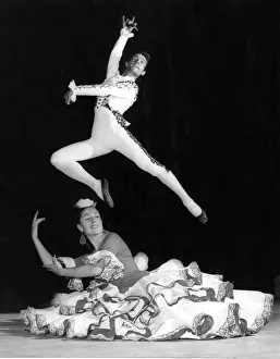 Alberto Portillo leading male dancer of the ballet leaps over dancer Nana Lorca during