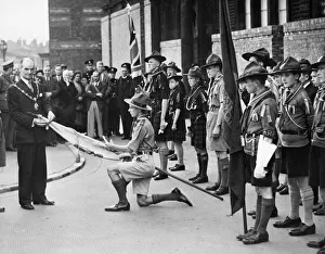 Alderman Kelly, Mayor of Bootle, pinning the Scouts Silver Cross for Gallantry to