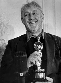 Alec Guinness receiving his Oscar for Best Actor in The Bridge on the River Kwai