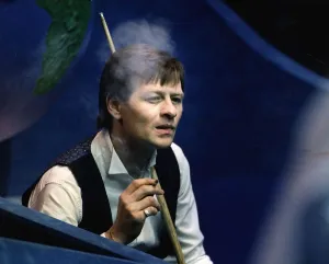 Alex Higgins snooker player alias Hurricane Higgins smoking cigarette during a match 1988