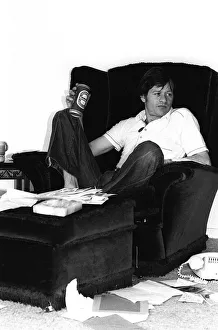 Alex Higgins World Snooker Champion 1982 sitting at home relaxing with a can of
