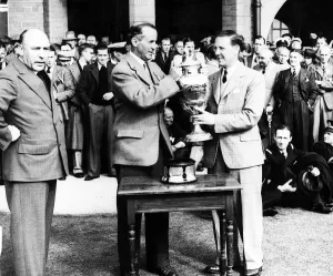 Alex Kyle receiving the amateur golf championship trophy from Mr Glover May 1936