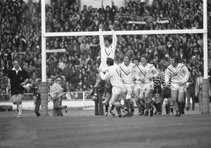 Alex Murphy celebrates scoring a try for Warrington during the Rugby League Cup Final