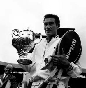 Mens Game Prints: Alex Olmedo wins the mens singles final at Wimbledon 1959 against Rod Laver holding up