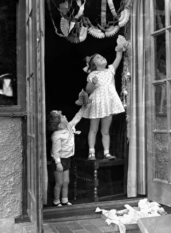 00080 Prints: Alfieri. 1273. Child Studies-Hanging up Christmas decorations. Betty Graves and Keith