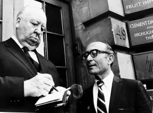 Alfred Hitchcock Film Director signs an autograph during a break from filming in Covent