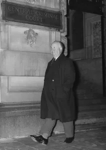 Directors Prints: Alfred Hitchcock - film producer and director -January 1959 Walking along with hands in