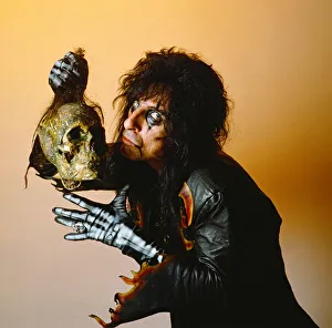 Alice Cooper holding a skeleton head. September 1987