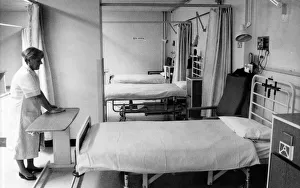 Alice Richards, cleans the empty Day Surgery Unit which is virtually closed due to lack