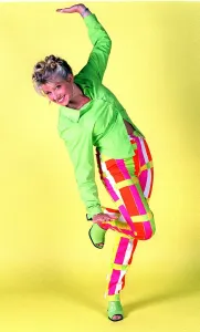 Presenters Prints: Alison Douglas TV Presenter with hair tied up wearing bright coloured trousers