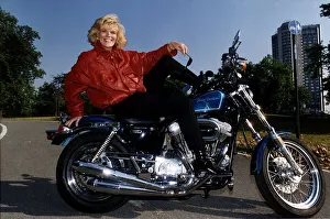 00126 Prints: Alison Holloway TV Presenter sitting on her Harley Davidson in Hyde Park