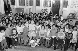 All smiles... pupils from Woodhouse Infant and Nursery School raise a cheer for Mrs