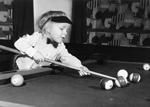 Allan Palmer Pool The hustler Allan Palmer aged 2 reaches across the table with his