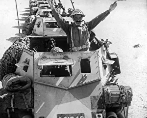 Middle East Prints: Allied armoured troop transports. The N. C. O. of the troop of eight carriers giving