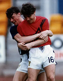 Ally McCoist and Duncan Ferguson wrestling with each other during training football