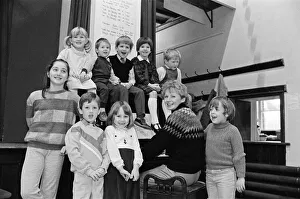 00523 Prints: Almondbury Methodist Junior Church Christmas Party, singing carols round the piano