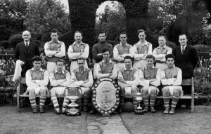 Alvechurch football club team group with trophies after winning the Redditch