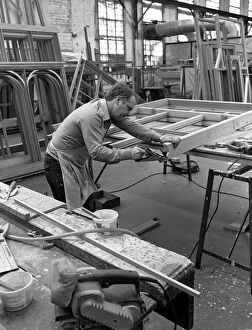 00661 Collection: Amdega Conservatories. Joiner puts the finishing touches to one of the joints of a
