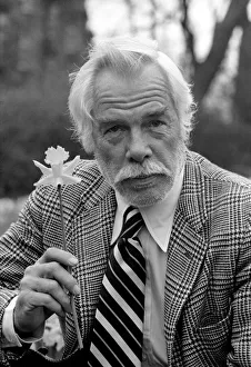 American actor Lee Marvin amongst the spring flowers during a visit to England
