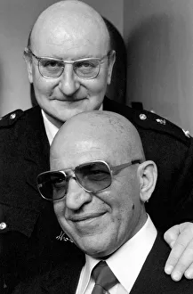 American actor Telly Savalas (bottom) who plays Kojak in the television series