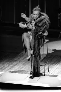 American actress and singer Eartha Kitt warms up that sultriest of voices during a dress