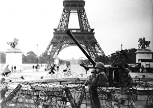 An American Army anti aircraft gun beside the Eiffel Tower after the liberation of Paris