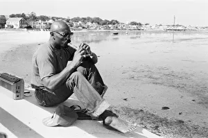 Flute Prints: American boxer Marvin Hagler relaxes with a flute ahead of his title challenge against