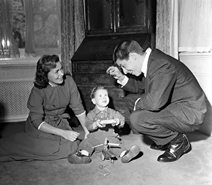 Men And Women Prints: American Comedian and actor Jerry Lewis at home with his wife playing with their son