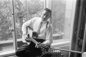 Country And Western Prints: American country singer and musician Johnny Cash poses for photographers at the Savoy