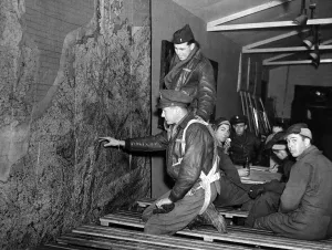 Airman Prints: American Eighth Army Air Force crew members of the B17 Flying Fortress looking at a map