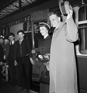 01163 Prints: American evangelist Billy Graham arrives with his wife Ruth at Euston Station in London