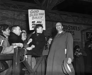 Microphones Prints: American evangelist Billy Graham salutes the huge crowd who gathered to welcome him