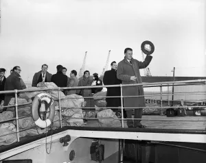 American evangelist Billy Graham salutes the huge crowd who gathered to welcome him