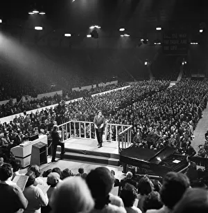 01163 Prints: American evangelist Billy Graham speaks to the crowd at the Harringay Arena in North