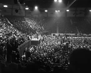 American evangelist Billy Graham speaks to the crowd at the Harringay Arena in North