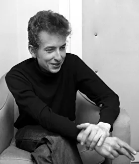 American folk singer Bob Dylan smoking a cigarette during an interview May 1964