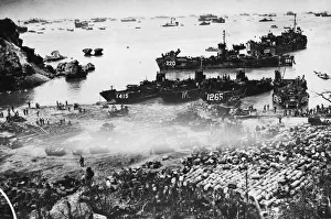Beachhead Prints: American landing craft on Okinawa. Landing craft nose inshore to land