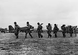 01207 Prints: American paratroopers file along with full equipment to board their transport for