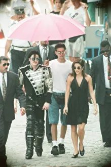 American pop singer Michael jackson with his new bride Lisa-Marie Presley walking