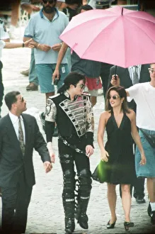 American pop singer Michael jackson with his new bride Lisa-Marie Presley walking