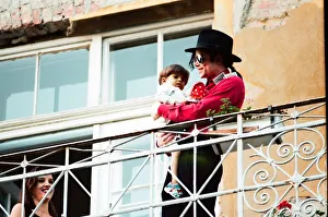 American pop singer Michael Jackson with young orphan Bela Farkas posing on a hotel