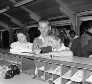 Scandal Prints: American rock and roll singer Jerry Lee Lewis signs immigration cards with his thirteen