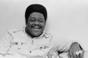 American rock and roll singer and musician Fats Domino shows off his diamond rings in his