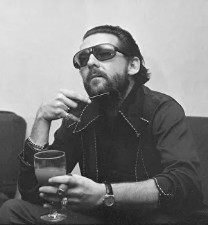 Moustaches Prints: American rock and roll singer and musician Jerry Lee Lewis relaxing in his hotel suite in