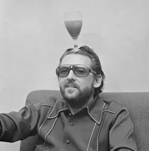 Moustaches Prints: American rock and roll singer and musician Jerry Lee Lewis relaxing in his hotel suite in
