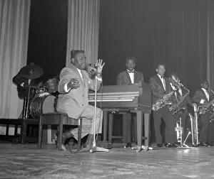 Pianist Prints: American rock and roll star Fats Domino at the piano on the stage of the Saville Theatre