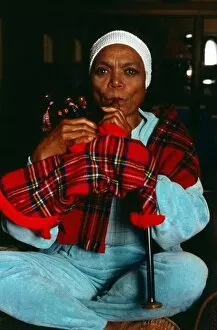 Images Dated 1st November 1989: American singer and actress Eartha Kitt blowing into bagpipes November 1989
