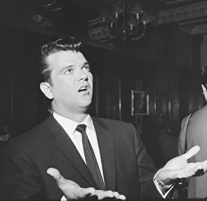 American singer Conway Twitty pictured upon his arrival in London. 6th May 1959